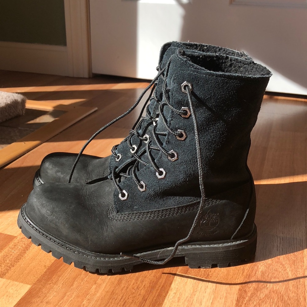 Black timberland boots with fuzz on the inside.